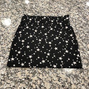 NWOT. Nollie Mini Skirt. Black with Stars.